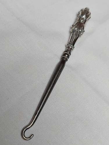 Verspielter knopfhaken - verspielter,